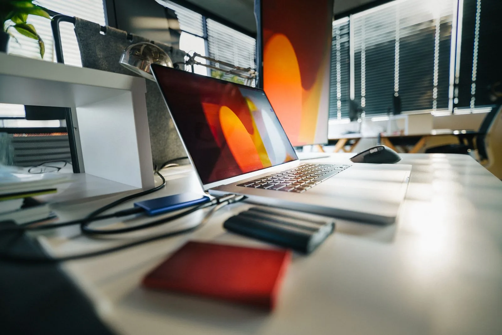 Laptop and external storage on an office desk